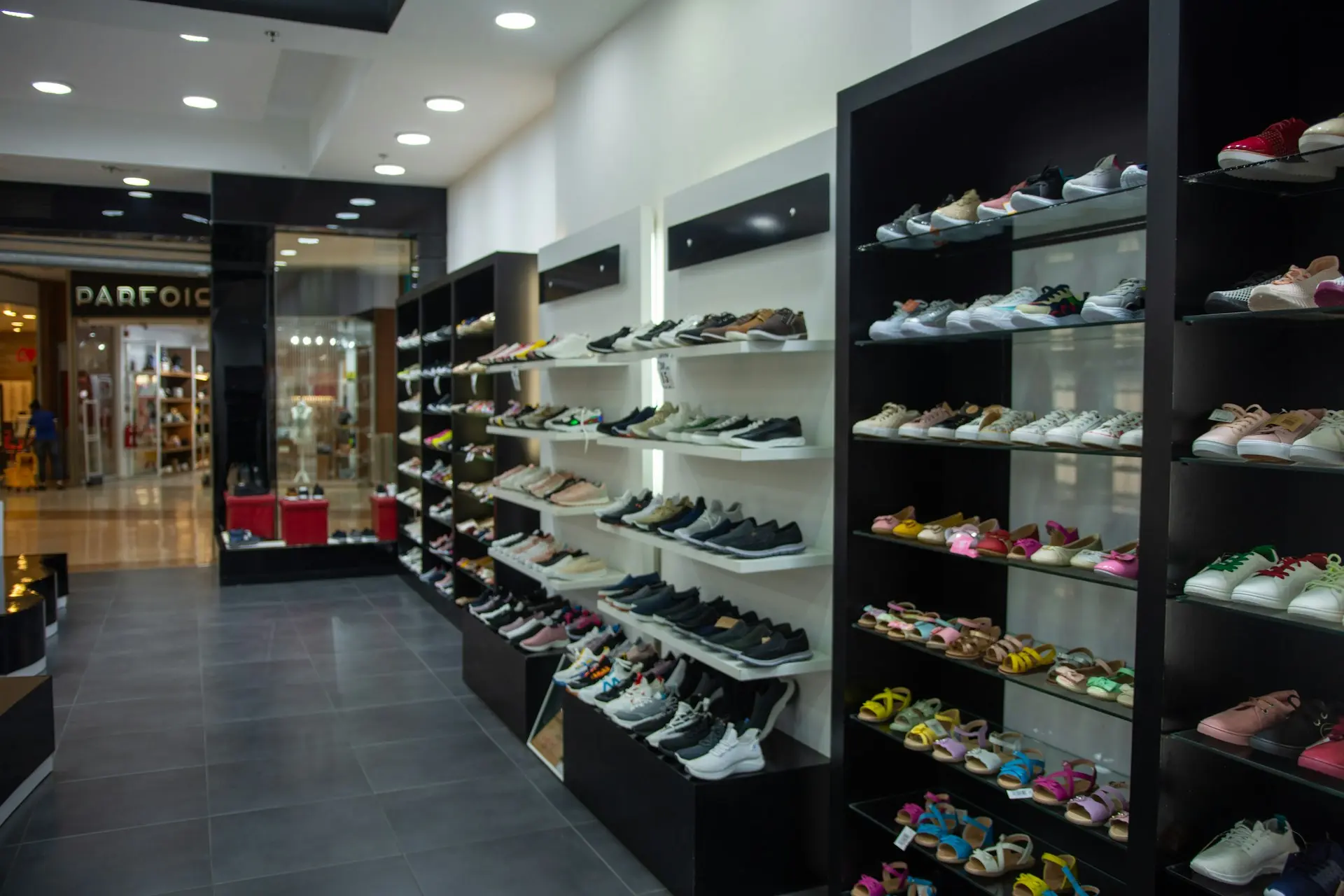 A shoe store displays many shoes.